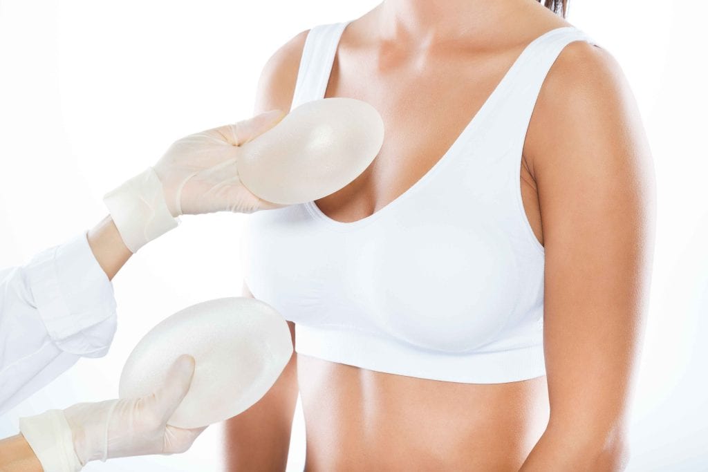 Silicone breast implants being prepared for cosmetic surgery at VJ Clinics.
