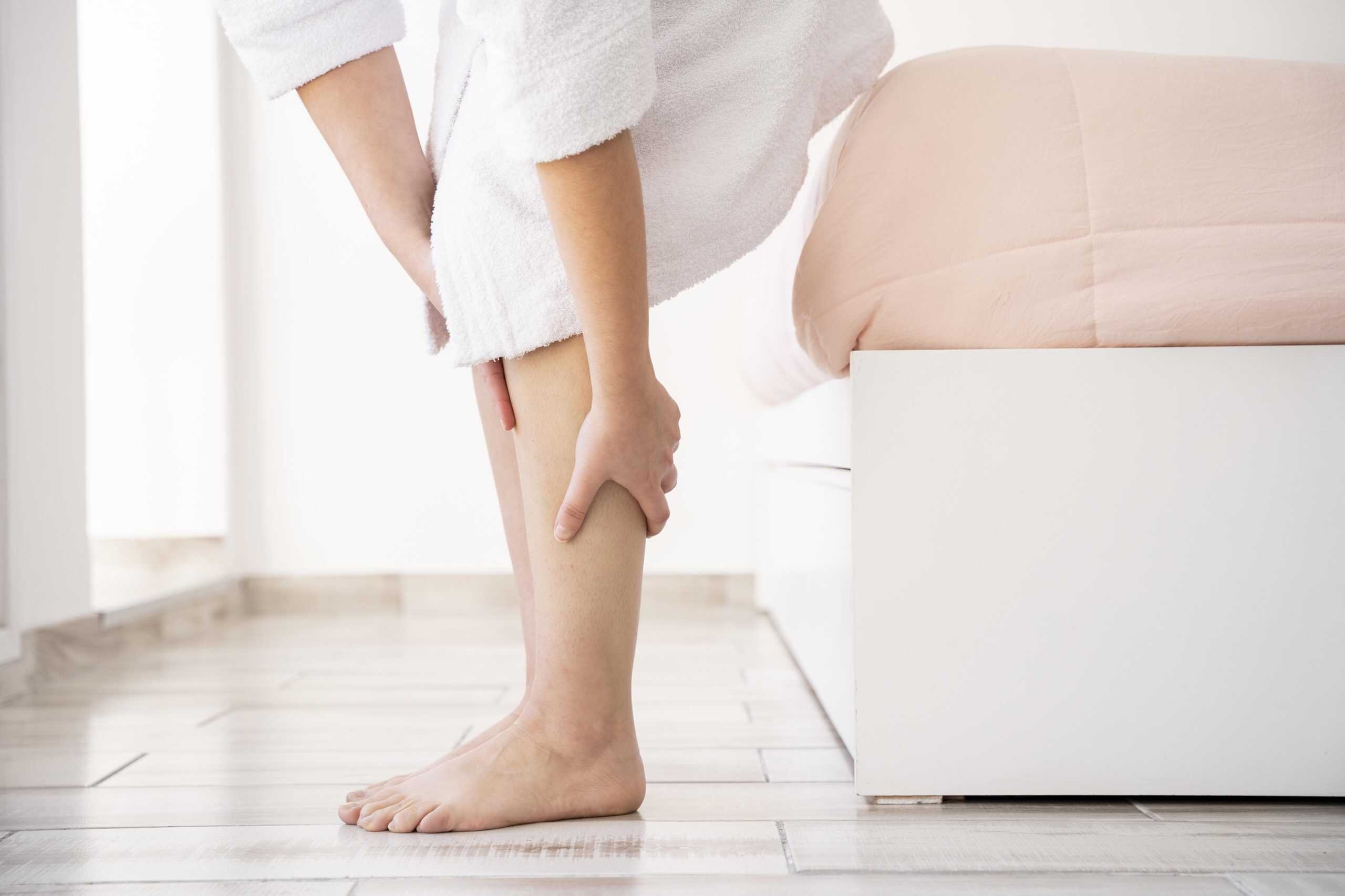 Relieved person stretching calves after leg therapy at VJ Clinics, promoting health and wellness.